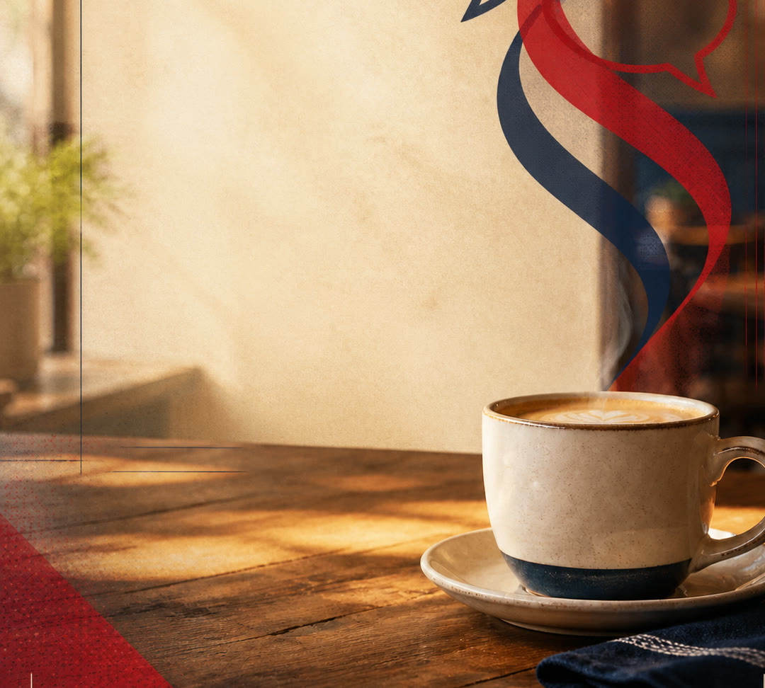A latte on a warm table with red and blue steam ribbons and conversation bubbles